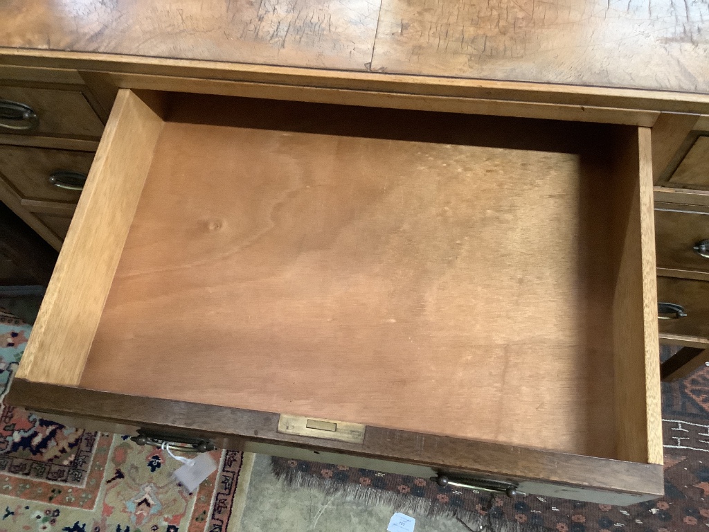 A mid 20th century Heals walnut kneehole desk, width 106cm depth 55cm height 78cm
